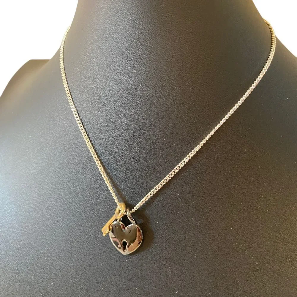 Gun Metal Heart Shaped Lock w/ Gold Tone Key on Serpentine Chain.